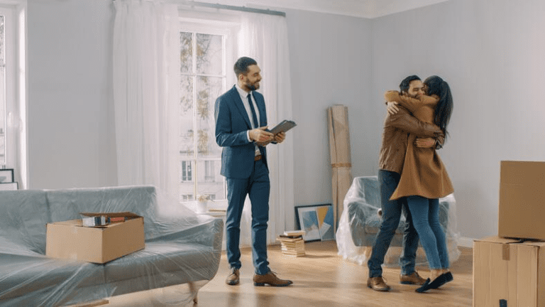 A real estate agent showing clients a new property