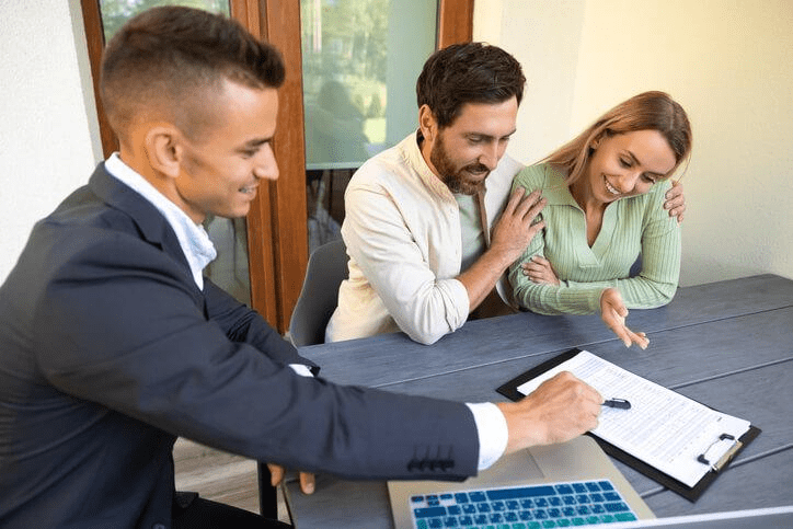 A real estate agent reviewing listings with clients
