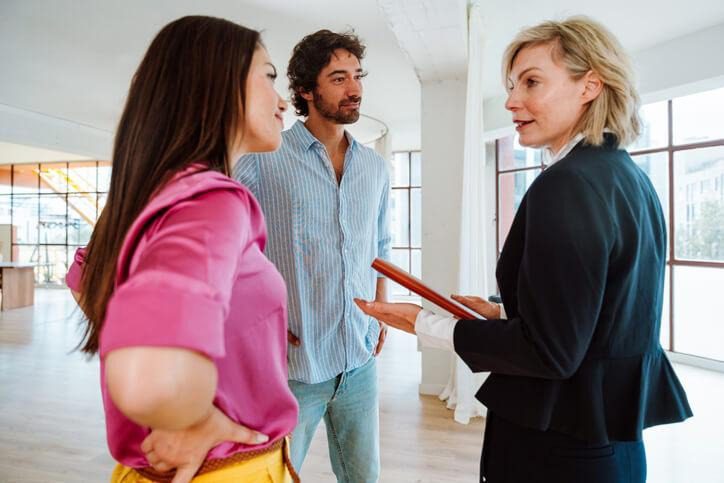 A real estate agent demonstrating ethical professionalism with clients in Ontario