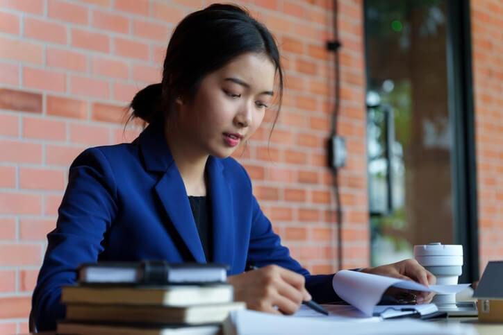 A Real Estate Broker Program candidate studying for real estate certification exams